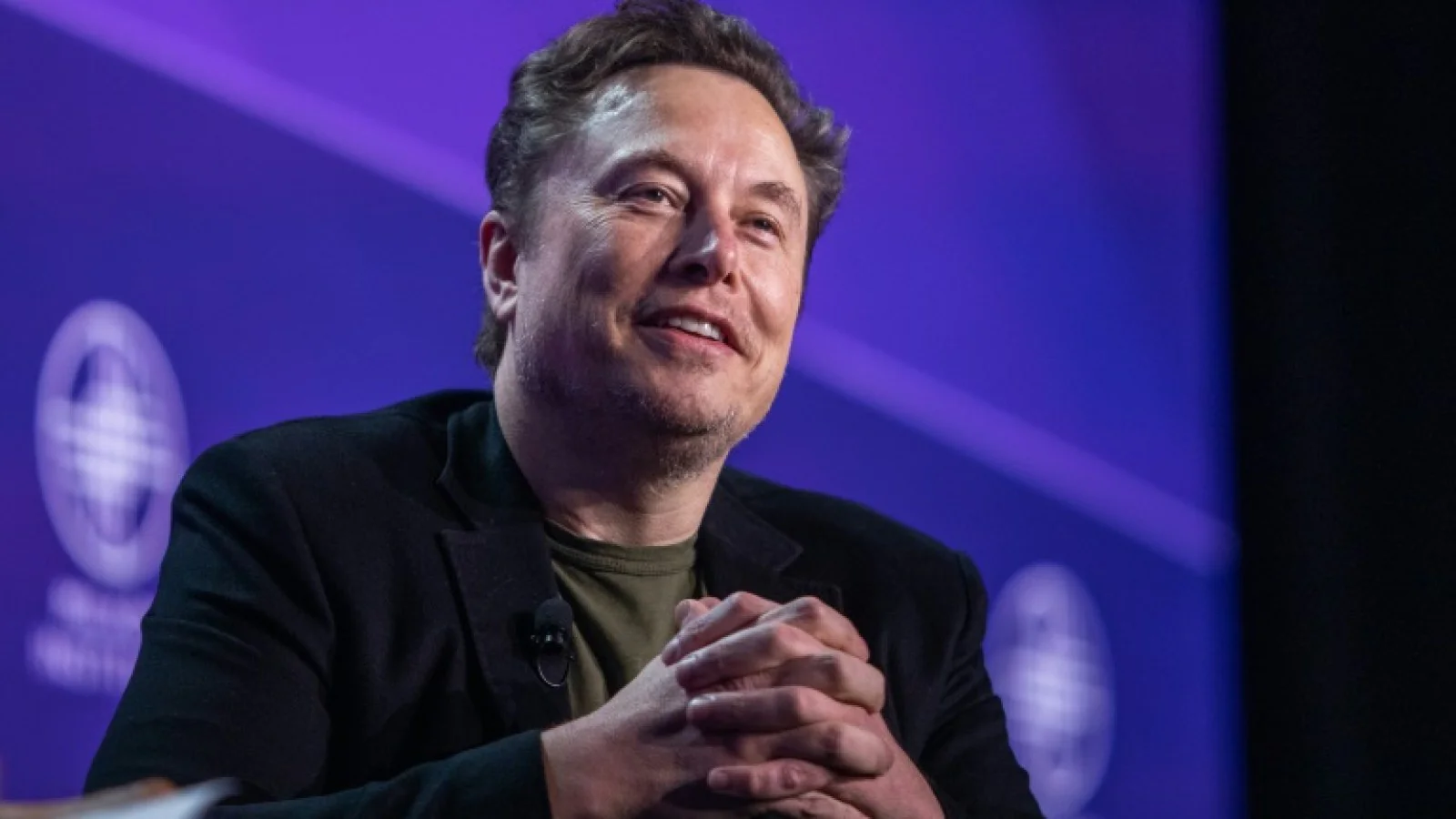 Elon Musk accuses Apple of violating anti-competition law, threatens legal action